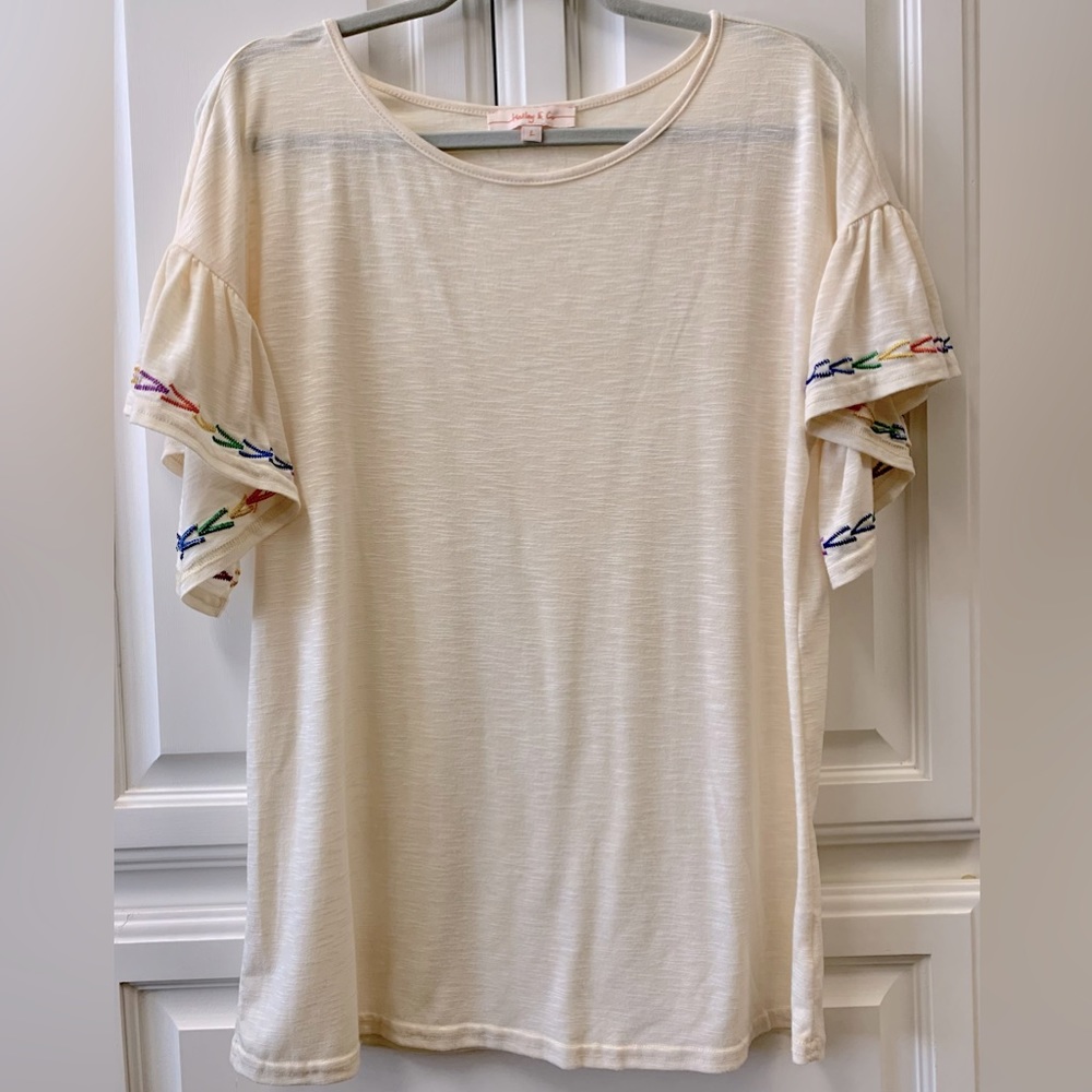 Hailey & Co shirt, size L. Cream with multicolored embroidery.